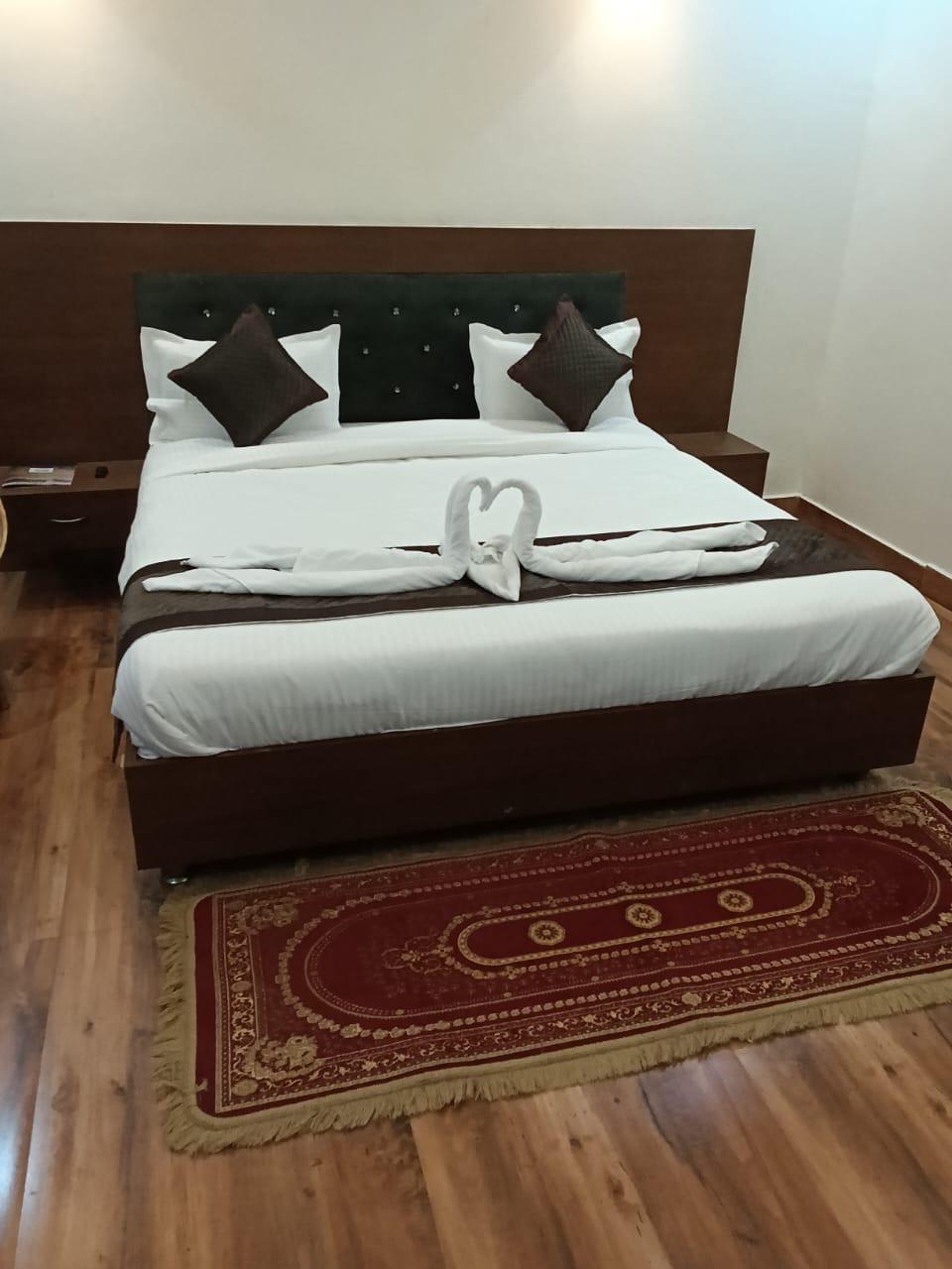 Luxury resort pool with palm trees at sunset